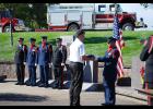 South Dakota Firefighters Association President Charlie Kludt presents a flag during the annual South Dakota Fallen Firefighters Memorial held Oct. 12 in Pierre. 